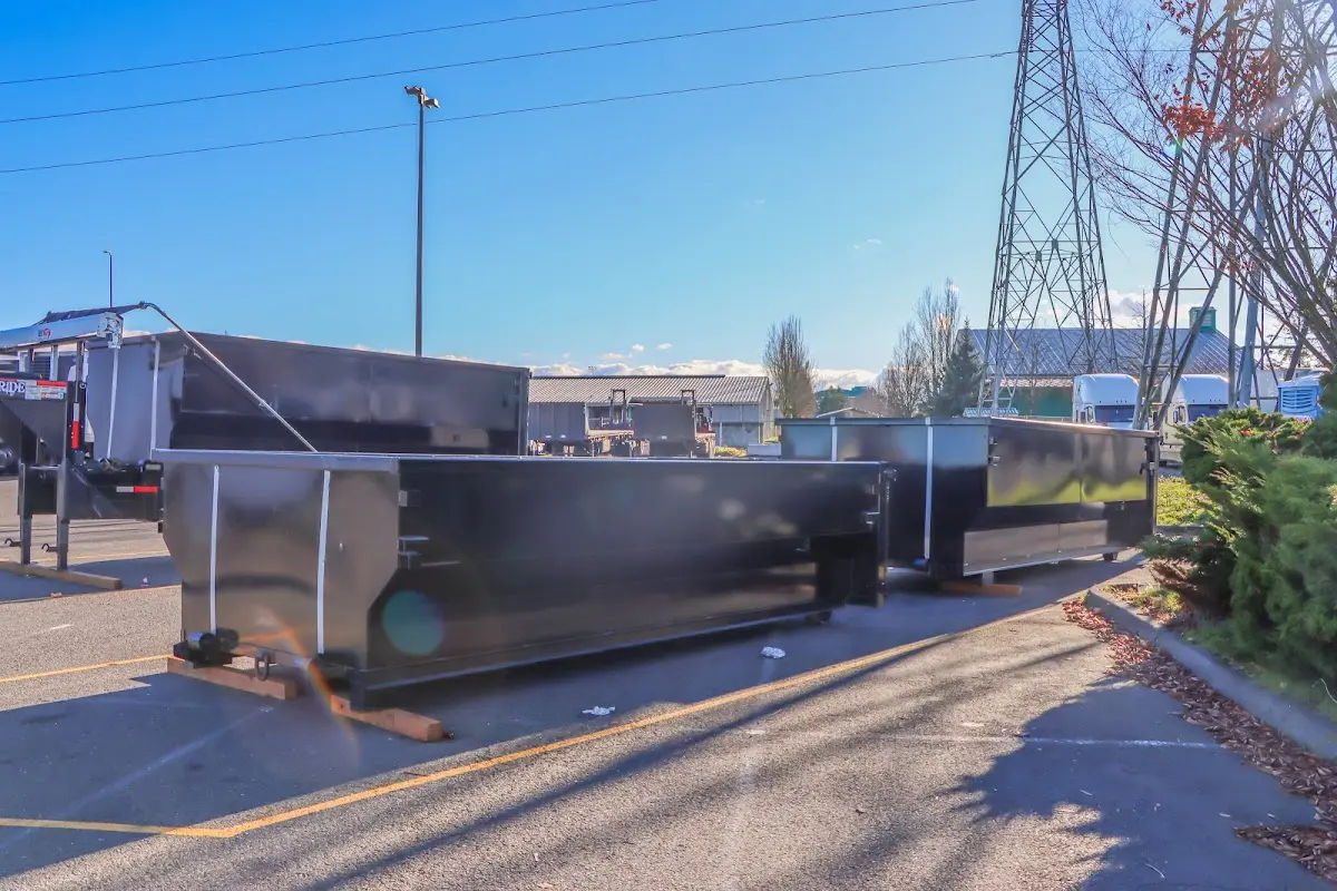 Roll-off dumpster ready for waste disposal at job site for 2 Yard Dumpster Rental in Dos Palos